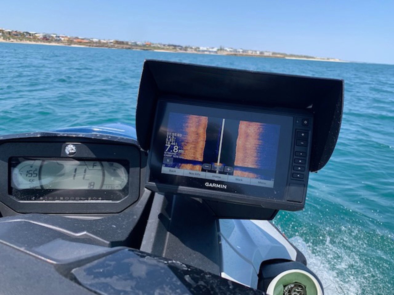 Black JetSkiVisor with orange Sea-Doo logo fitted on a Garmin fish finder